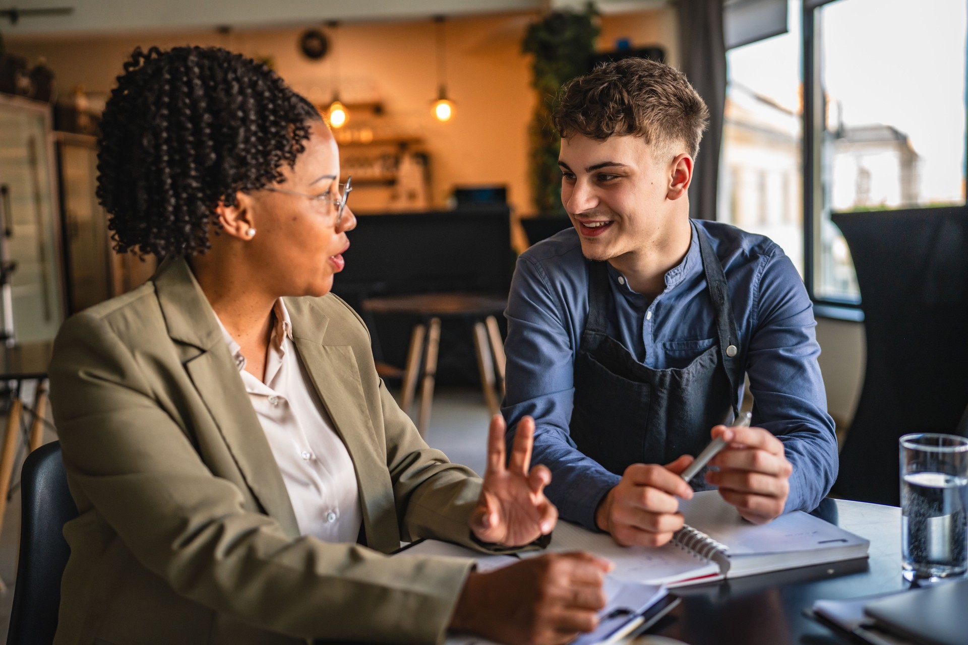 young man entrepreneur on the meeting with female financial adviser